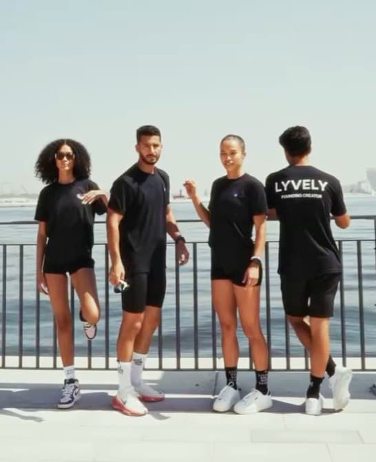 Lyvely: Four runners in Lyvely activewear on a waterfront promenade
