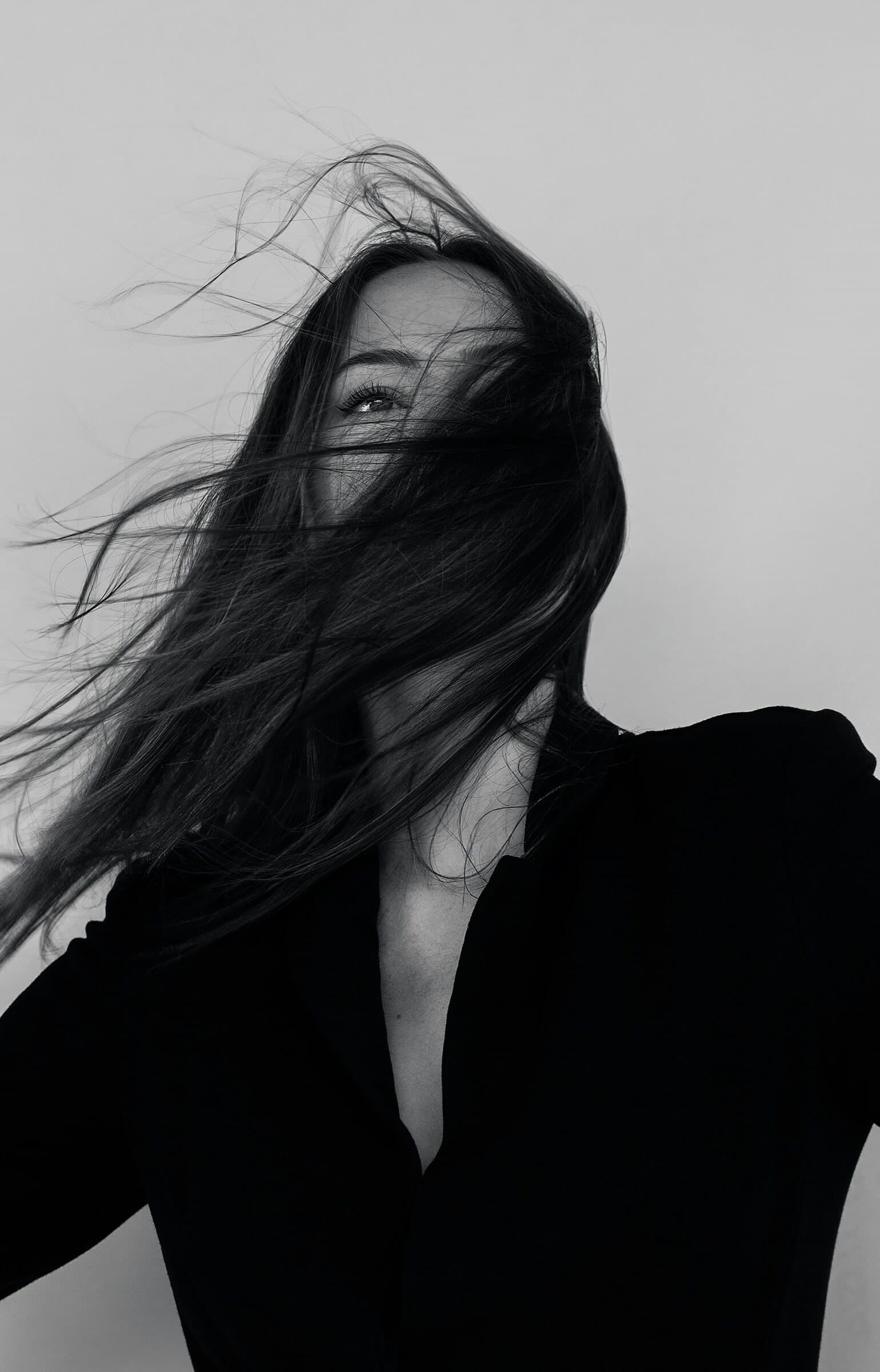 Black and white portrait, hair in motion