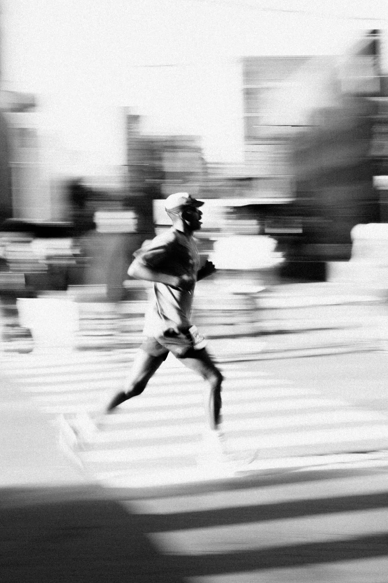 Runner crossing a street, motion blur