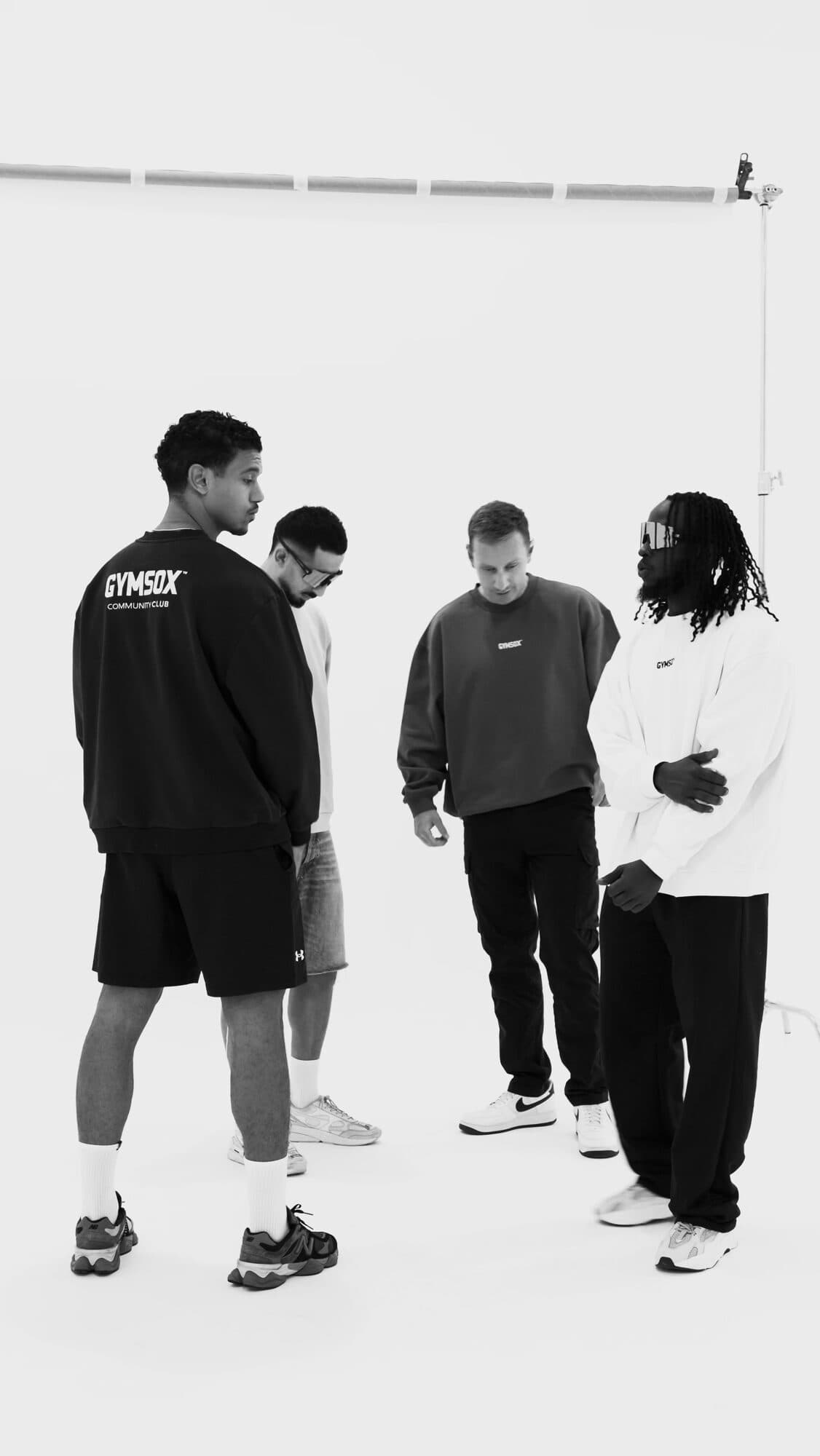 Black and white frame of the crew from the GymSox behind-the-scenes film